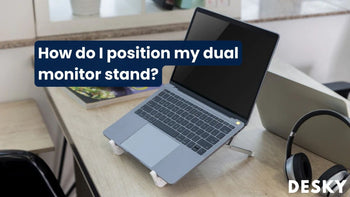 How do I position my dual monitor stand?