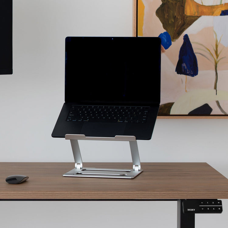 Laptop stand riser on top of desk
