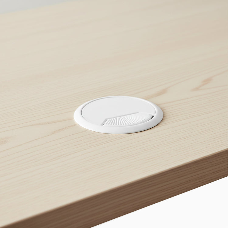 White cable grommet hole on desk