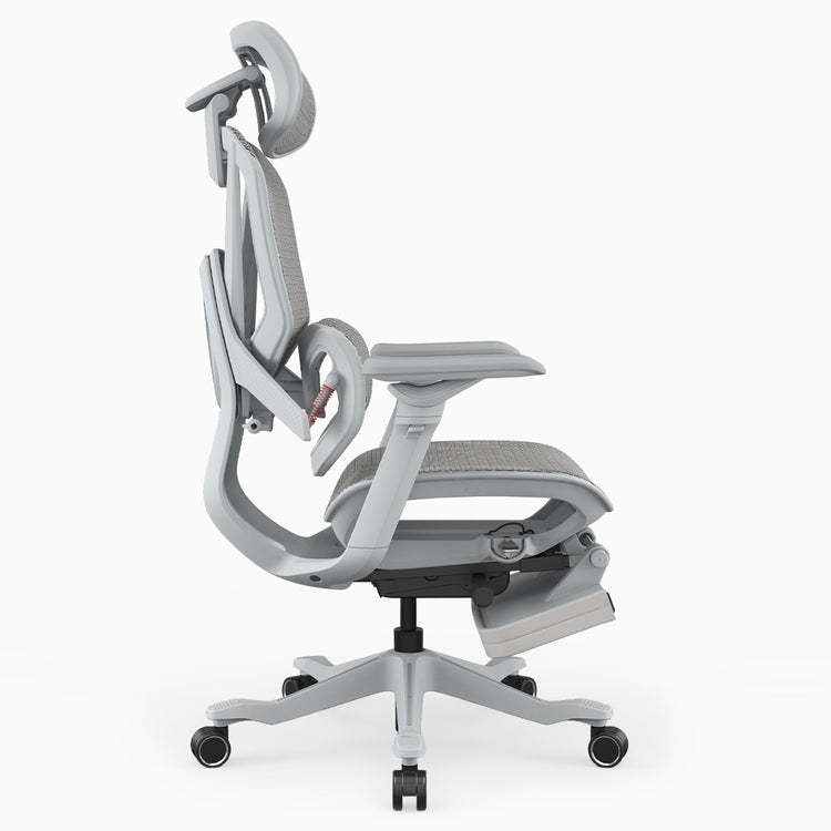 A light gray ergonomic office chair with a headrest, adjustable armrests, and a footrest, shown from a side profile view on a white background.