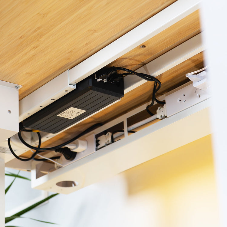 Desky integrated cable channel and power tray under desk