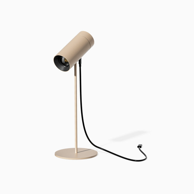 Desky spotlight desk lamp in sand with usb c cable charging