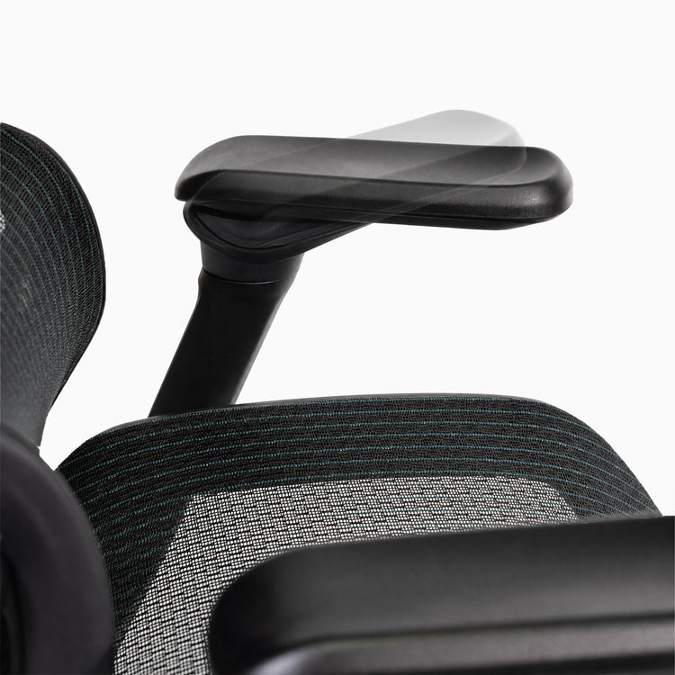 Close-up of contourra chair with adjustable armrest