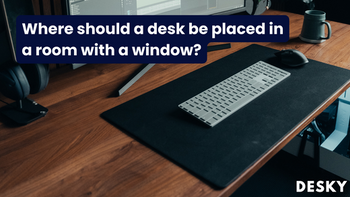 Where should a desk be placed in a room with a window?