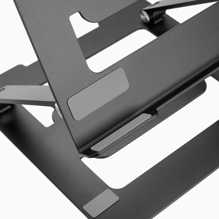 Black portable laptop riser with silicone pads for protection