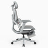 A light gray ergonomic office chair with a headrest, adjustable armrests, and a footrest, shown from a side profile view on a white background.