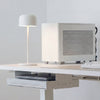 Desky rechargeable cordless lamp in white on top of desk