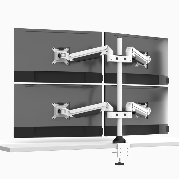 Desky Quad Monitor Arm attached to monitors