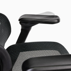 Close-up of contourra chair with adjustable armrest