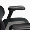 Close-up of contourra chair with adjustable armrest