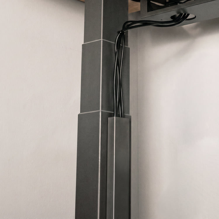 Black magnetic cable management on desk frame